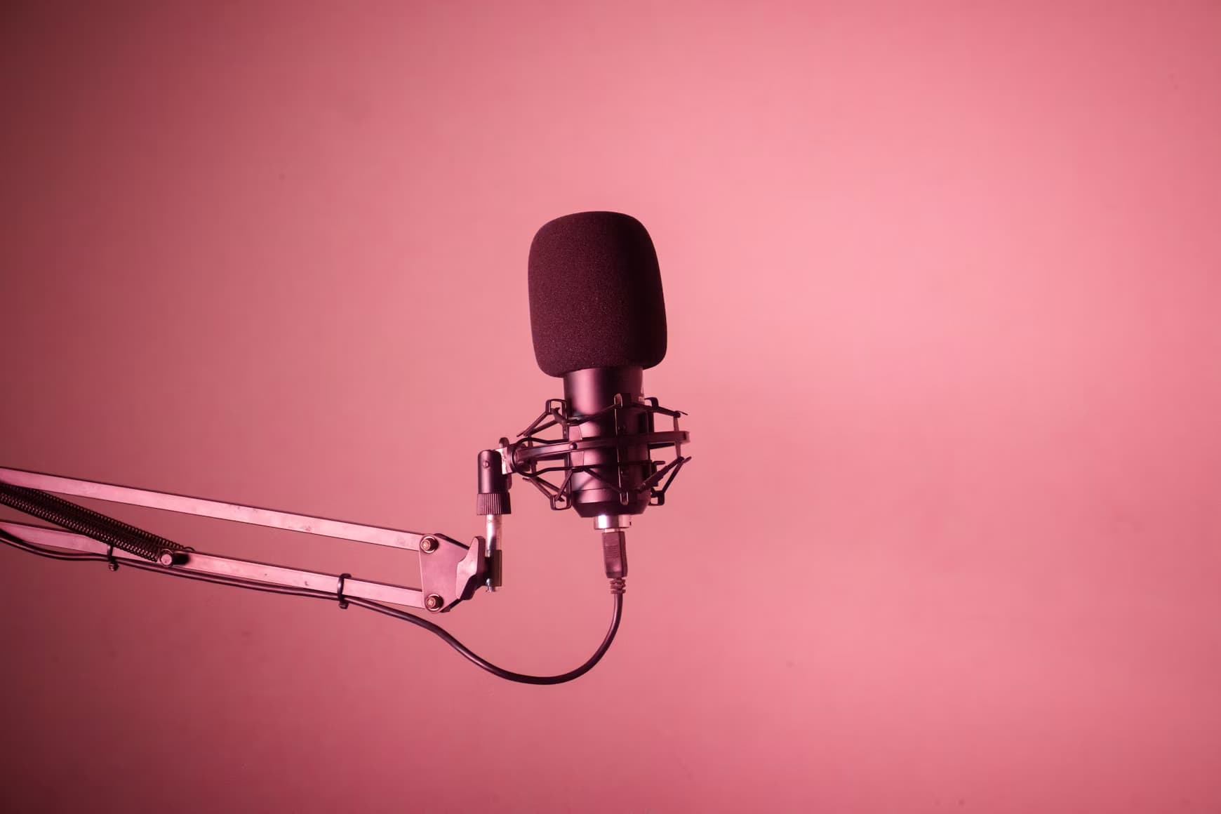 Close-up of a podcast microphone ahead of a Crossed Wires Festival 2026 show.